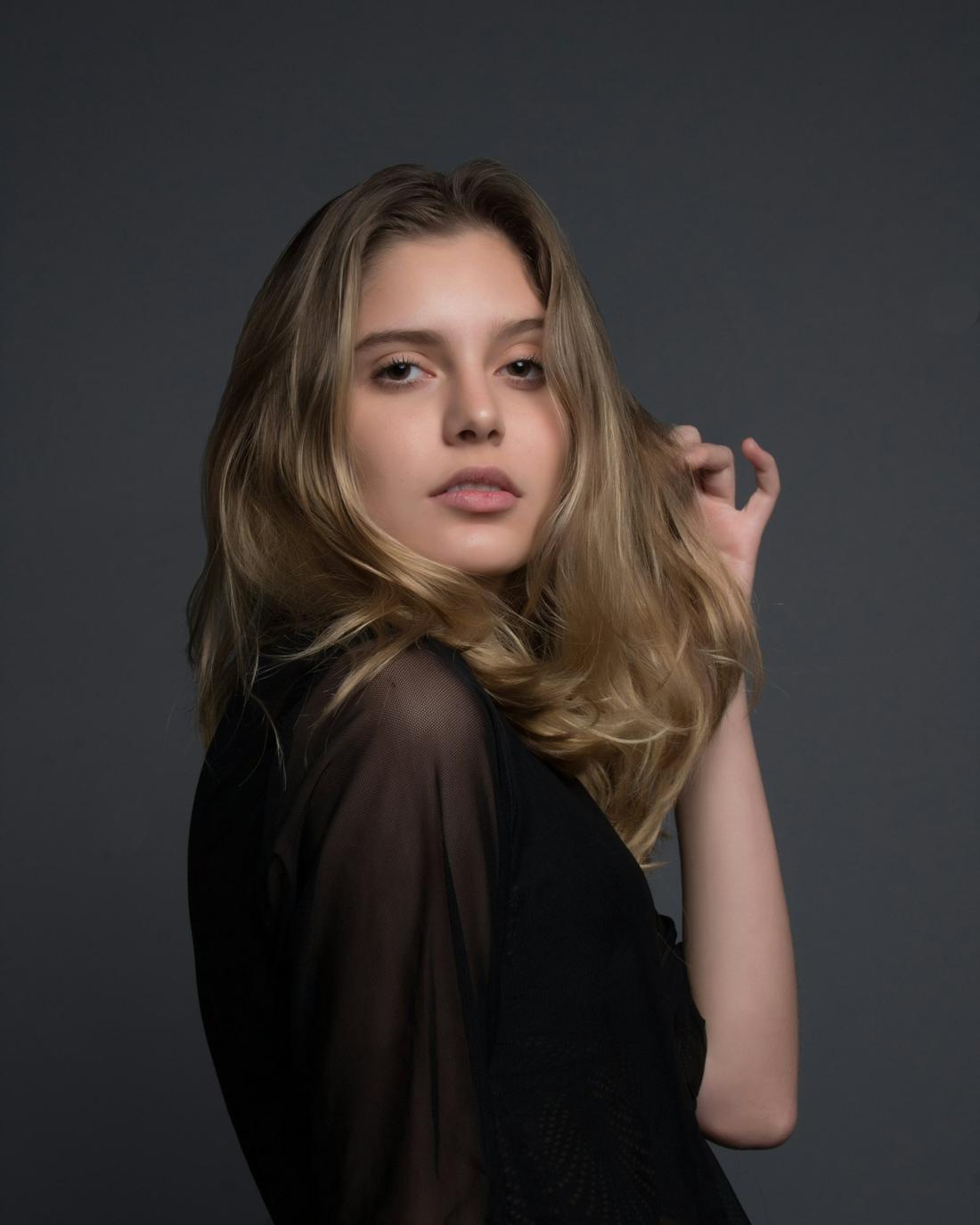 A woman with long brunette waves
